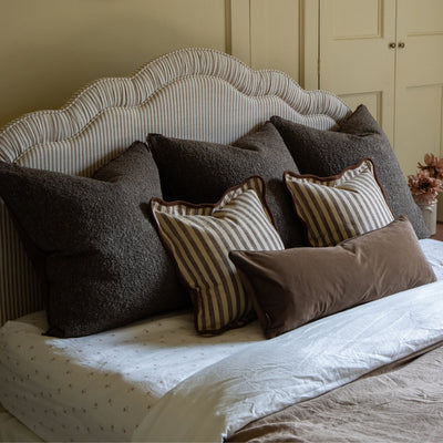 Dark Brown Cushions on a Bed