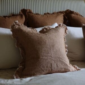 hallie washed rust ruffle cushion